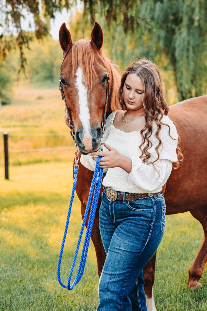 Portrait of Megan riding Duke, her favorite horse, under stormy skies