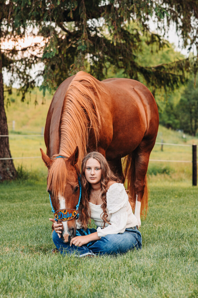 Scenic shot of Megan and one of her horses near the water feature