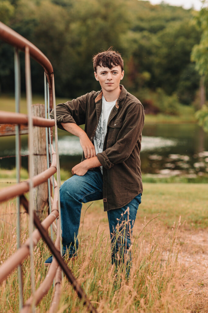 Ian Wacker standing on the dock during his senior photo session