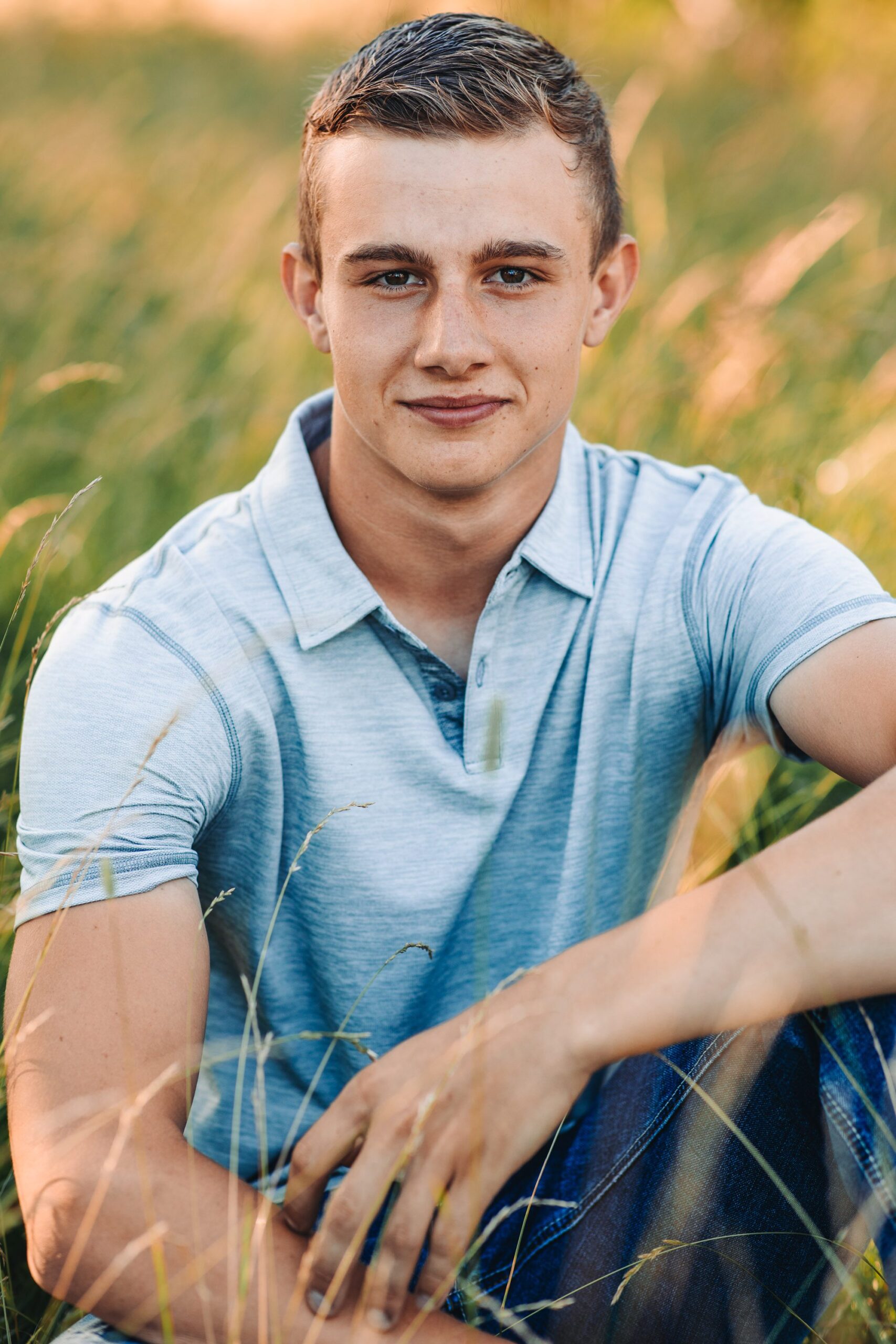 Belmont Wisconsin high school senior guy sitting in a field